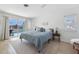 Bright bedroom with a sliding glass door that provides pool views and natural light at 840 Park Rd, Englewood, FL 34223