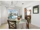 Bright dining area with views of the pool at 840 Park Rd, Englewood, FL 34223