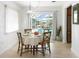 Bright dining area with views of the pool at 840 Park Rd, Englewood, FL 34223