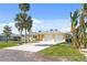 Charming single-story home with a two-car garage, set amid tropical landscaping at 840 Park Rd, Englewood, FL 34223