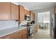 Updated kitchen featuring quartz countertops, stainless steel appliances, and tile backsplash at 840 Park Rd, Englewood, FL 34223