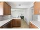 Bright kitchen with quartz countertops and views to the living room at 840 Park Rd, Englewood, FL 34223