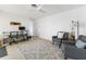 Bright living area with two chairs, desks, and white ceiling fan at 840 Park Rd, Englewood, FL 34223