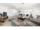 Bright living room featuring a modern design, lots of natural light, and stylish decor at 840 Park Rd, Englewood, FL 34223