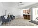Open living area with barstool seating at the kitchen island and a view of the outdoors at 840 Park Rd, Englewood, FL 34223
