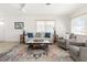 Inviting living room featuring a modern design, lots of natural light, and stylish decor at 840 Park Rd, Englewood, FL 34223