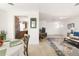 Bright living room with an open layout, seamlessly connecting the kitchen and dining spaces at 840 Park Rd, Englewood, FL 34223