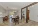 Open dining area with hardwood floors and views of the backyard and pool area, creating an inviting space at 849 Linnaen Nw Ter, Port Charlotte, FL 33948