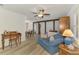 Bright living room with hardwood floors, neutral paint, and a seamless transition to the dining area at 849 Linnaen Nw Ter, Port Charlotte, FL 33948