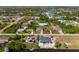 Expansive aerial view captures a residential neighborhood near a winding canal at 9054 Calumet Blvd, Port Charlotte, FL 33981