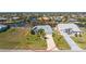 Aerial view of the home and its surrounding neighborhood with boating canals at 9325 Saint Paul Dr, Port Charlotte, FL 33981