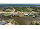 An attractive single-Gathering home with a boat dock, screened-in pool, and idyllic waterfront views at 9325 Saint Paul Dr, Port Charlotte, FL 33981