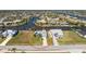 Wide aerial view of the home and its surrounding neighborhood with boating canals and residences at 9325 Saint Paul Dr, Port Charlotte, FL 33981