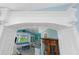 Elegant archway leads into a cozy living room with water views and comfortable seating at 9325 Saint Paul Dr, Port Charlotte, FL 33981