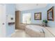 Bright bathroom featuring a soaking tub, tiled walls, glass block window, and a walk-in shower at 9325 Saint Paul Dr, Port Charlotte, FL 33981