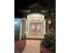 Charming front entrance features decorative glass double doors, columns, and lush landscaping at 9325 Saint Paul Dr, Port Charlotte, FL 33981
