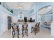 Kitchen bar with seating and an open view to the living area at 9325 Saint Paul Dr, Port Charlotte, FL 33981