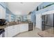 Kitchen featuring stainless steel appliances, granite countertops and lots of natural light at 9325 Saint Paul Dr, Port Charlotte, FL 33981