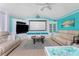 Stylish living room with water views, built-in shelving, and comfortable seating at 9325 Saint Paul Dr, Port Charlotte, FL 33981