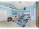Bright living room featuring nautical decor, vaulted ceilings, and a view of the water at 9325 Saint Paul Dr, Port Charlotte, FL 33981