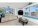 Living room offers beautiful water views, lots of natural light, and comfortable seating at 9325 Saint Paul Dr, Port Charlotte, FL 33981