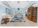 Bright living room featuring stylish furnishings, tile flooring, and a view of the outdoor pool at 9325 Saint Paul Dr, Port Charlotte, FL 33981