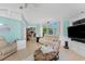 Open-concept living room featuring tile floors and access to other living spaces at 9325 Saint Paul Dr, Port Charlotte, FL 33981