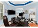 Spacious office featuring a large desk, computer, and views into other rooms at 9325 Saint Paul Dr, Port Charlotte, FL 33981