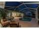 Enclosed pool area with ample seating offers a private and relaxing outdoor space for entertainment at 9325 Saint Paul Dr, Port Charlotte, FL 33981