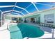 Private screened-in pool with a spacious deck, providing an ideal space for outdoor entertaining at 9325 Saint Paul Dr, Port Charlotte, FL 33981