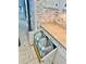 Convenient pull-out laundry hampers within the cabinet for easy storage and organization at 9325 Saint Paul Dr, Port Charlotte, FL 33981