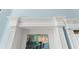 Ornate trim on door frame leading to canal-front patio, offering picturesque outdoor access at 9325 Saint Paul Dr, Port Charlotte, FL 33981