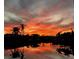 Scenic sunset reflects on the tranquil waterfront, creating a serene backdrop for this waterfront property at 9325 Saint Paul Dr, Port Charlotte, FL 33981