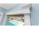 Detailed view of a window with decorative trim and a view of the pool area at 9325 Saint Paul Dr, Port Charlotte, FL 33981