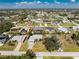Aerial view of a residential neighborhood featuring a single-Gathering home with a screened-in pool at 9430 Heartwellville Ave, Englewood, FL 34224