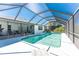 A private screened-in pool with a beautiful view is a great place to cool off at 9430 Heartwellville Ave, Englewood, FL 34224