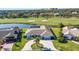 Stunning single-story home featuring a well-manicured lawn and golf course views at 977 N Doral Ln, Venice, FL 34293