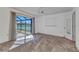 Bedroom with a sliding glass door and peaceful view of the lake at 977 N Doral Ln, Venice, FL 34293