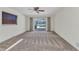 Spacious carpeted bedroom features a ceiling fan, and a beautiful pool view at 977 N Doral Ln, Venice, FL 34293