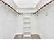 Organized walk-in closet with shelving and hanging rods at 977 N Doral Ln, Venice, FL 34293