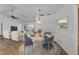 Open-concept living area with dining space, modern decor, and comfortable seating arrangement at 977 N Doral Ln, Venice, FL 34293