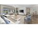 Bright living room features hardwood floors, neutral decor, and pool views through sliding doors at 977 N Doral Ln, Venice, FL 34293
