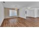 Large living room featuring new floors and an elegant chandelier at 977 N Doral Ln, Venice, FL 34293
