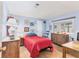 Cozy bedroom featuring wood floors, a window, a double bed, and ample storage at 985 Jolanda Cir, Venice, FL 34285