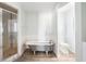 Charming bathroom featuring a claw foot tub, walk-in shower, and stylish fixtures at 1104 Larchmont Dr, Englewood, FL 34223