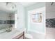 Stylish bathroom with tiled shower, modern fixtures, and a bright window at 1104 Larchmont Dr, Englewood, FL 34223