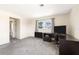 Bright bedroom with a large window, ceiling fan, neutral tones and carpet at 1104 Larchmont Dr, Englewood, FL 34223