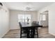This stylish dining area showcases a modern table, chairs, and ample natural light for enjoyable meals at 1104 Larchmont Dr, Englewood, FL 34223