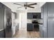 This modern kitchen boasts gray cabinets, stainless steel appliances, and ample space for cooking and storage at 1104 Larchmont Dr, Englewood, FL 34223
