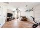 Spacious living room with tile flooring, a ceiling fan, and comfortable seating at 1104 Larchmont Dr, Englewood, FL 34223